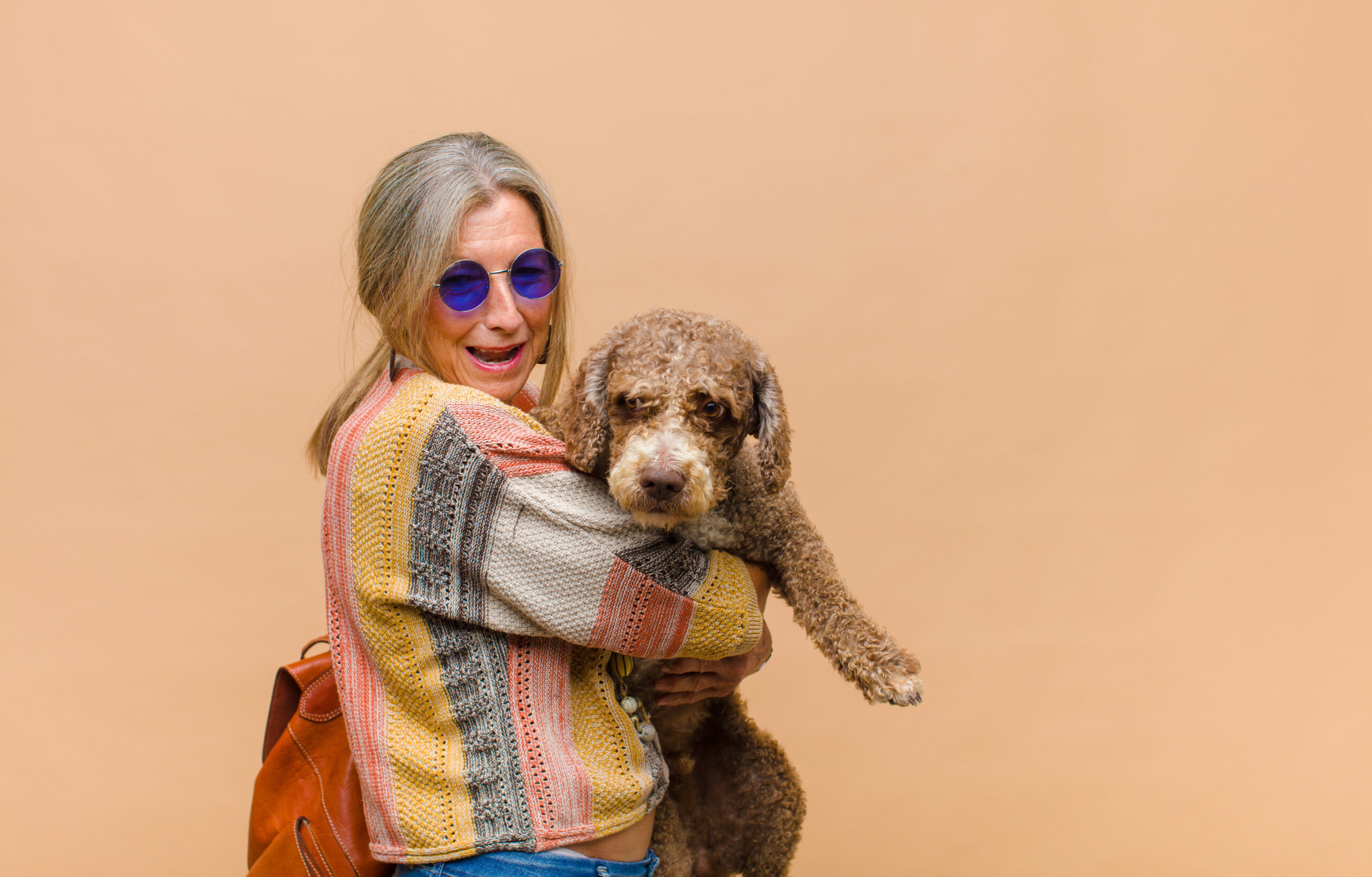 middle age hippie woman with a dog