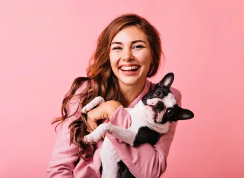 Wonderful european female model chilling in studio with puppy. I